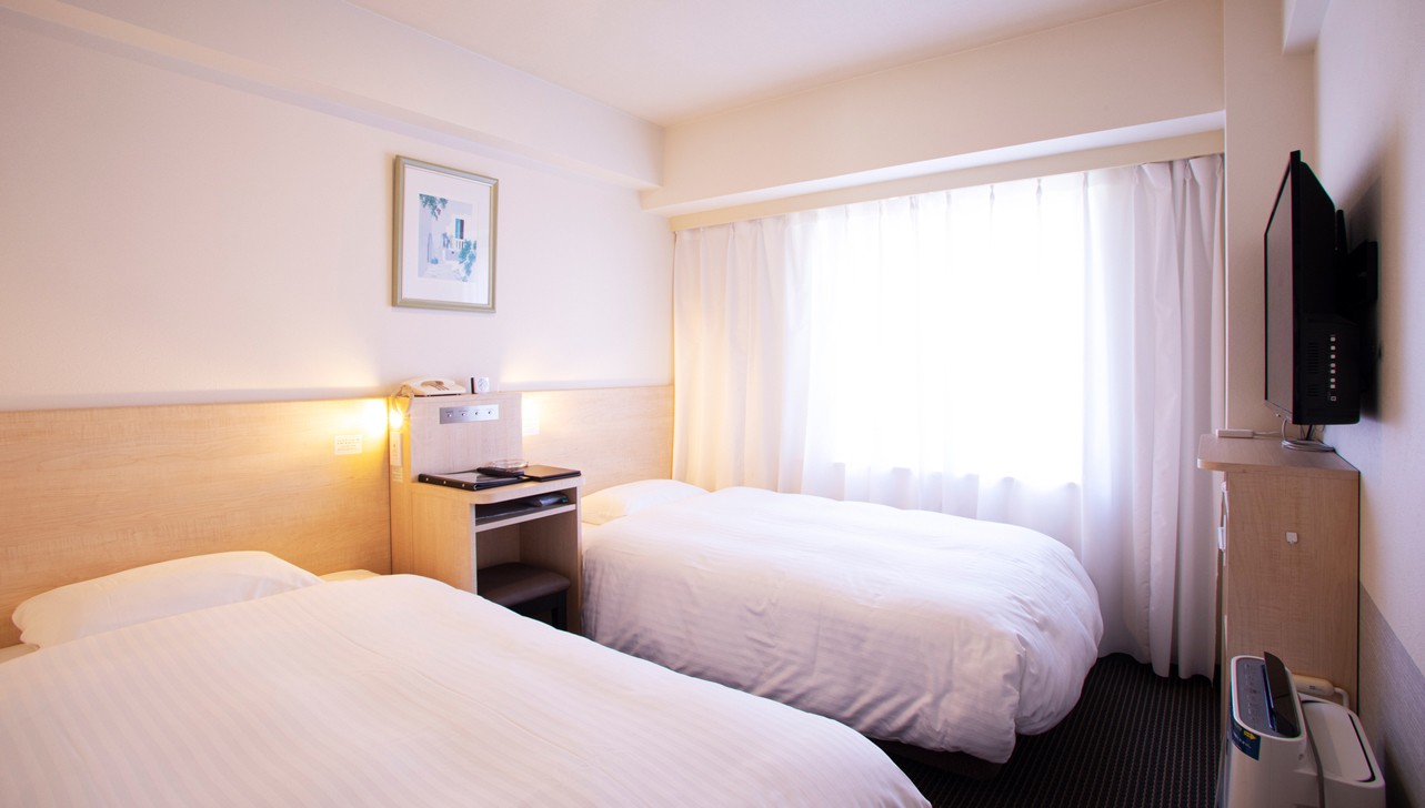 写真：エコノミーツインルームベッド周辺